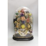 A Victorian painted mache fruit arrangement under a glass dome, 52cms high