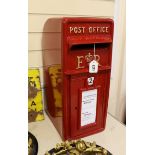 A Queen Elizabeth II red painted post box, 57cm tall