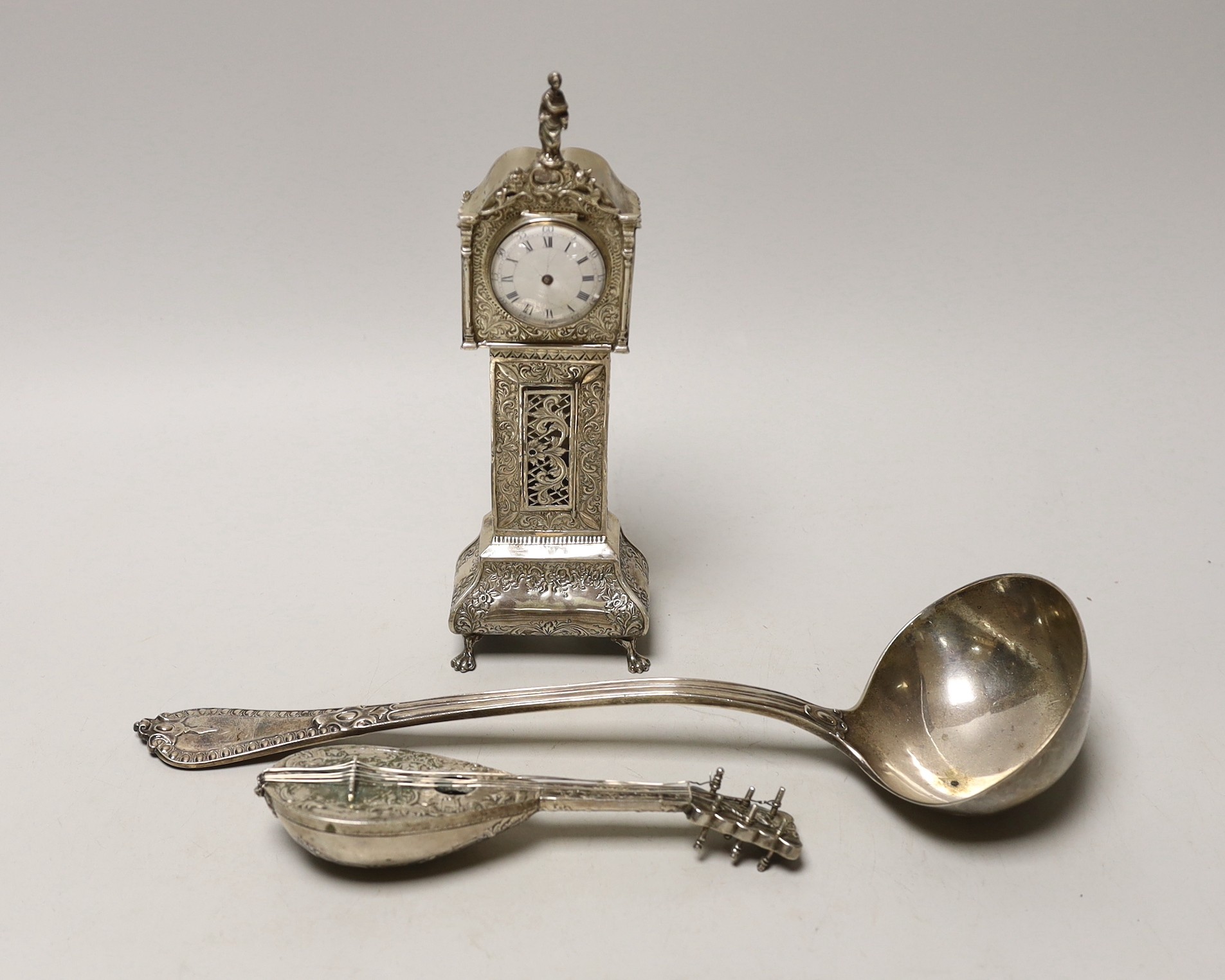 A Dutch white metal miniature longcase clock, 23.8cm, a similar model of a mandolin and a