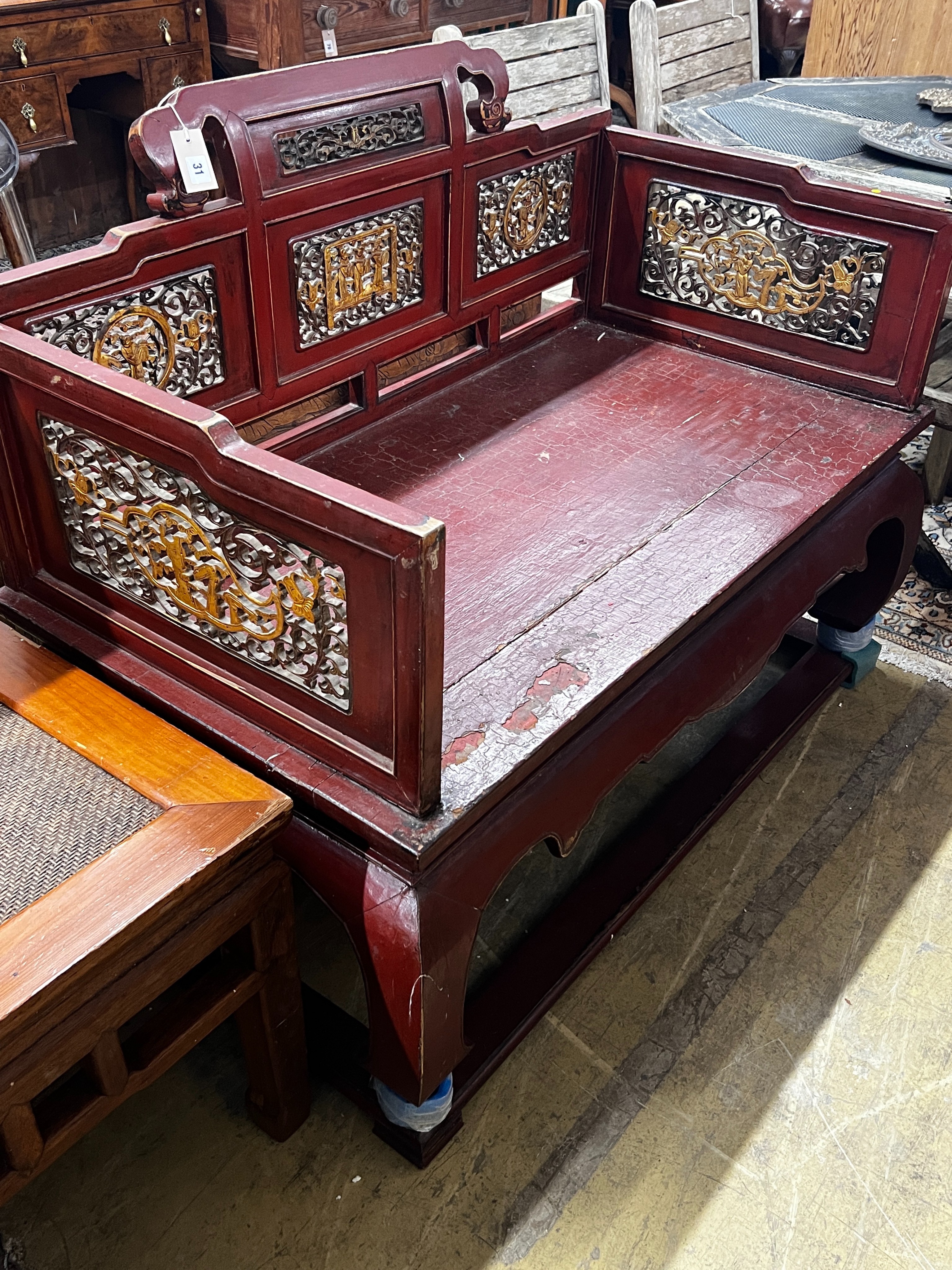 A Chinese scarlet lacquer parcel gilt bench, length 125cm, depth 70cm, height 97cm