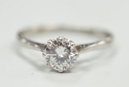A white metal (stamped plat) and solitaire diamond ring, size P, gross weight 2.9 grams, the stone