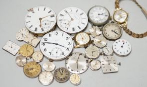A collection of assorted wrist and pocket watch parts.