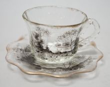 An unusual Emile Galle enamelled miniature glass cup and saucer. 6cm tall