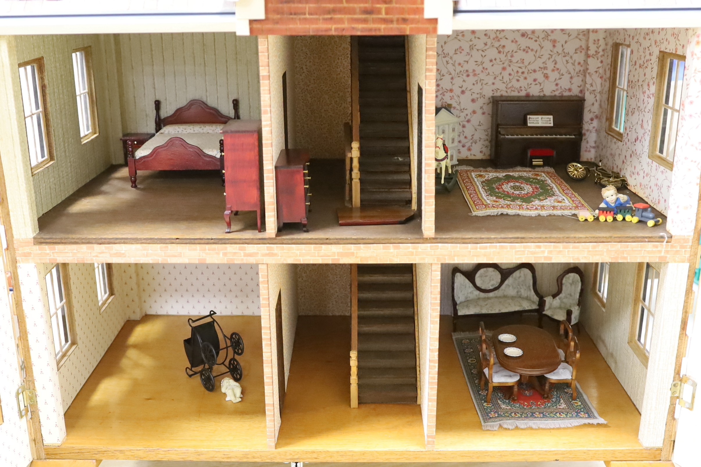 A mid 20th century doll's house and contents, 84cms x 100cms high - Image 2 of 6