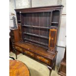 A George III style banded oak dresser, with boarded rack, width 163cm, depth 44cm, height 198cm