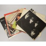 A collection of five Beatles LP’s to include top opening White Album