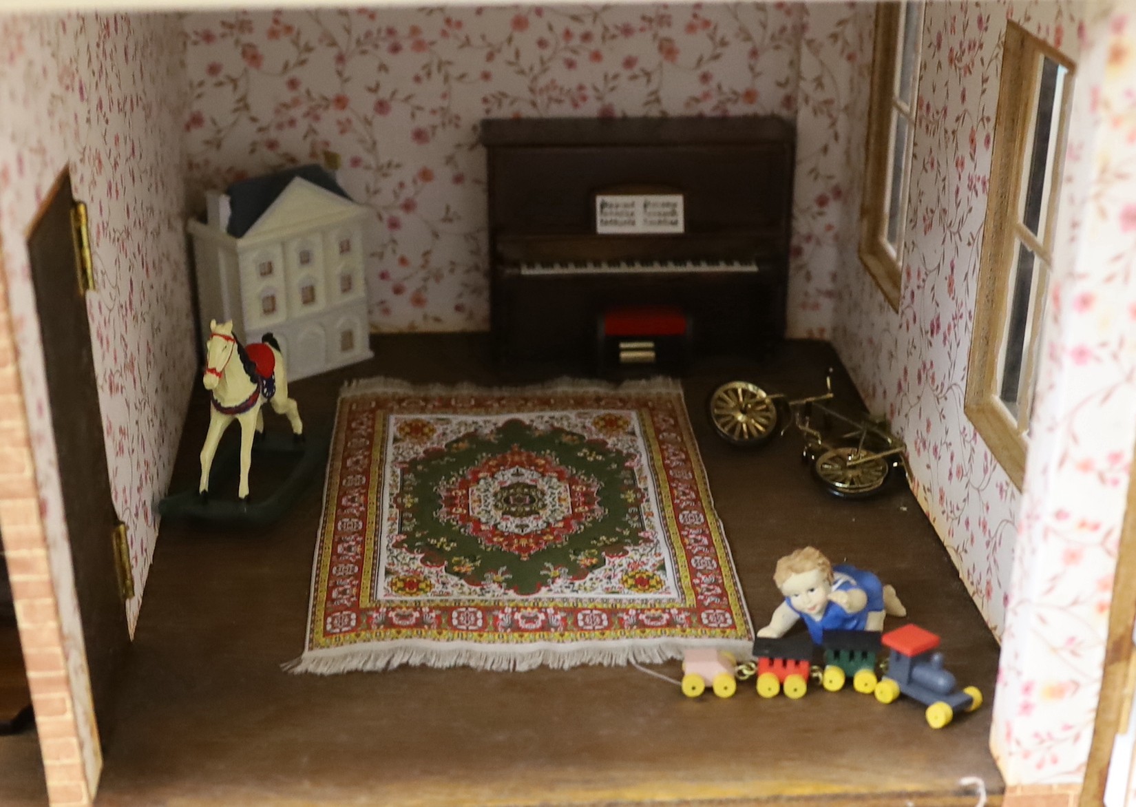 A mid 20th century doll's house and contents, 84cms x 100cms high - Image 4 of 6