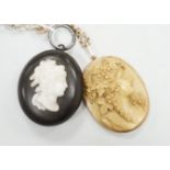 A late Victorian yellow metal mounted oval lava pendant, carved with the bust of a lady to sinister,