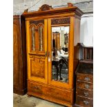 A late Victorian satin walnut and burr elm two door mirrored wardrobe, width 130cm, depth 50cm,