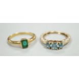 A modern 18ct gold and single stone emerald set ring, size M, gross weight 4 grams and a modern