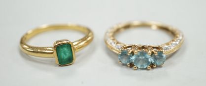 A modern 18ct gold and single stone emerald set ring, size M, gross weight 4 grams and a modern