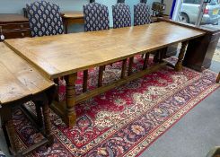 A large 18th century style rectangular oak refectory dining table, length 296cm, depth 89cm,