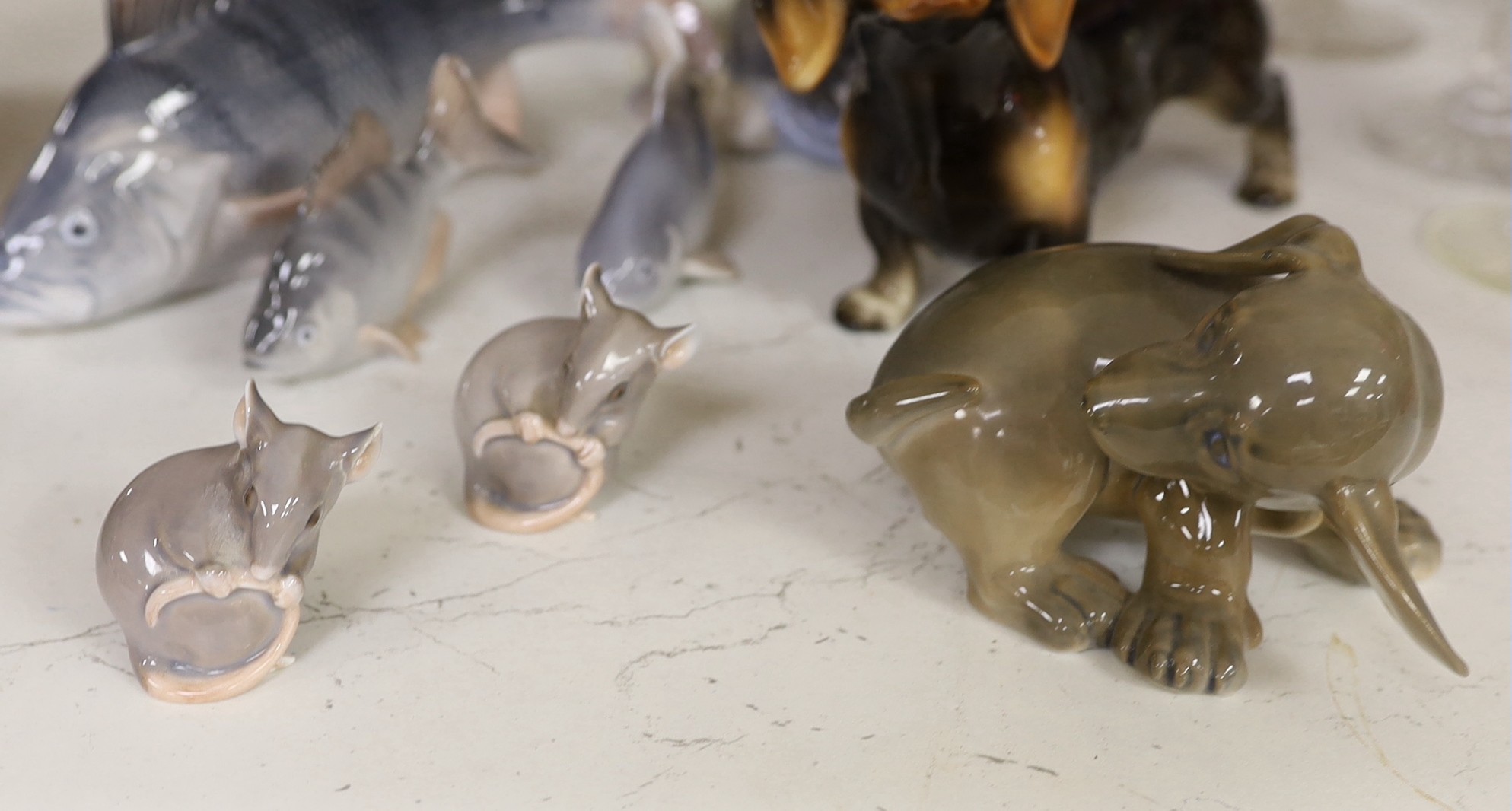 A Royal Copenhagen figure group of two children hugging a puppy, two other dog ornaments, three fish - Image 2 of 2