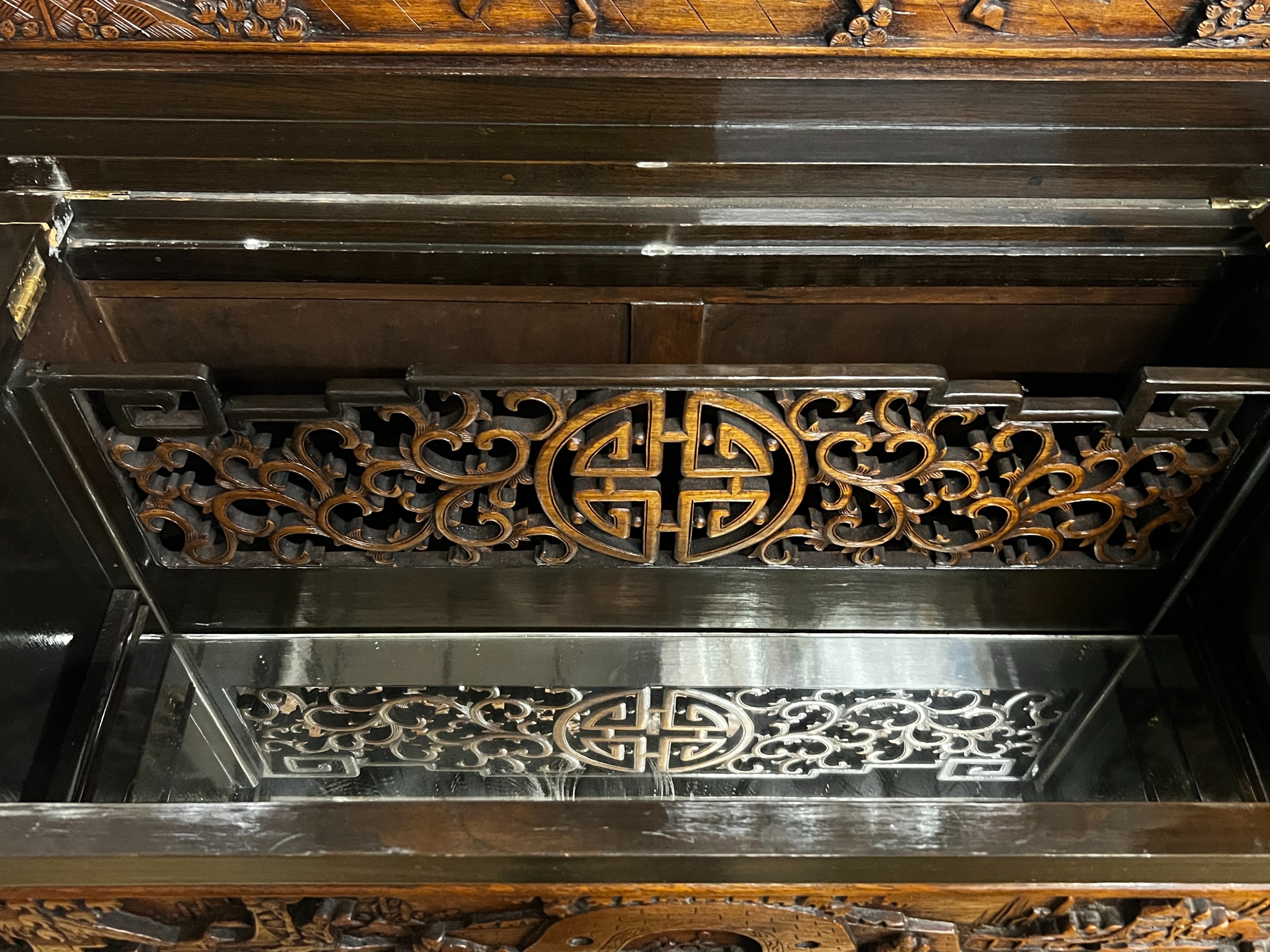 A Chinese carved hinged top cocktail cabinet with mirrored interior, width 111cm, depth 46cm, height - Image 7 of 9