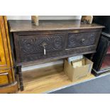 An early 20th century Jacobean revival oak low dresser, width 138cm, depth 48cm, height 93cm