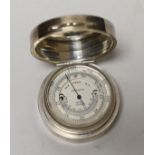 A George V Asprey & Co silver cased barometer, London, 1922, diameter 56mm.