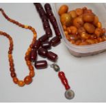 A single strand graduated amber bead necklace, 54cm gross weight 30 grams, together with loose amber
