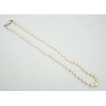 A single strand culture pearl necklace, with paste set sterling clasp, 38cm.