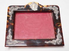 An Edwardian silver mounted tortoiseshell photograph frame, import marks for London, 1909, width