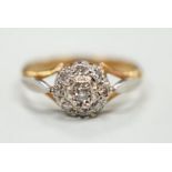 An 18ct and diamond cluster set ring, size K, gross weight 2.4 grams.