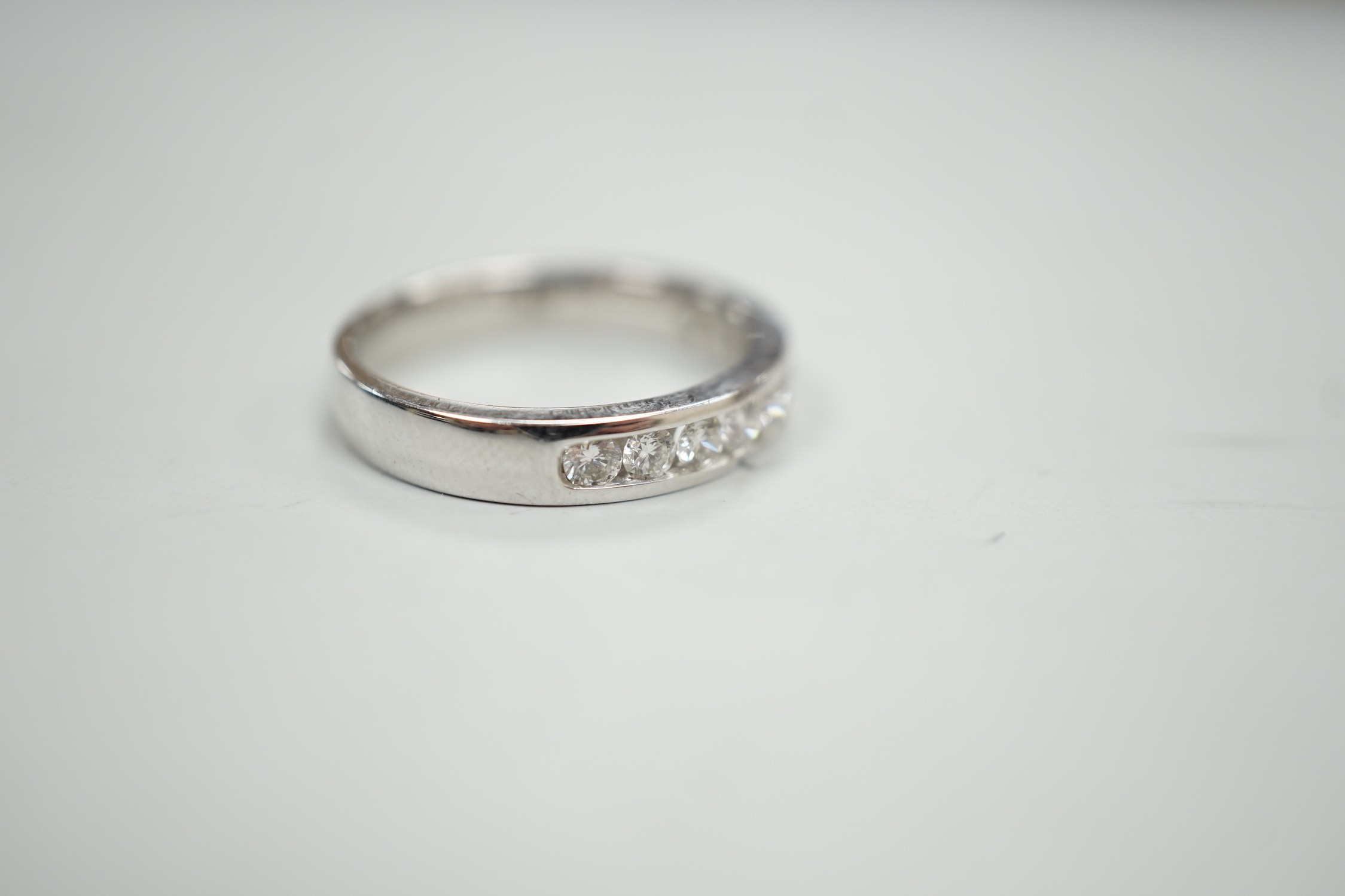 A modern 18k white metal and ten stone channel set diamond half eternity ring, size L/M, gross - Image 4 of 5
