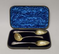 A cased set of two George III parcel gilt silver spoons and a matching sifter spoon, George Burrows,