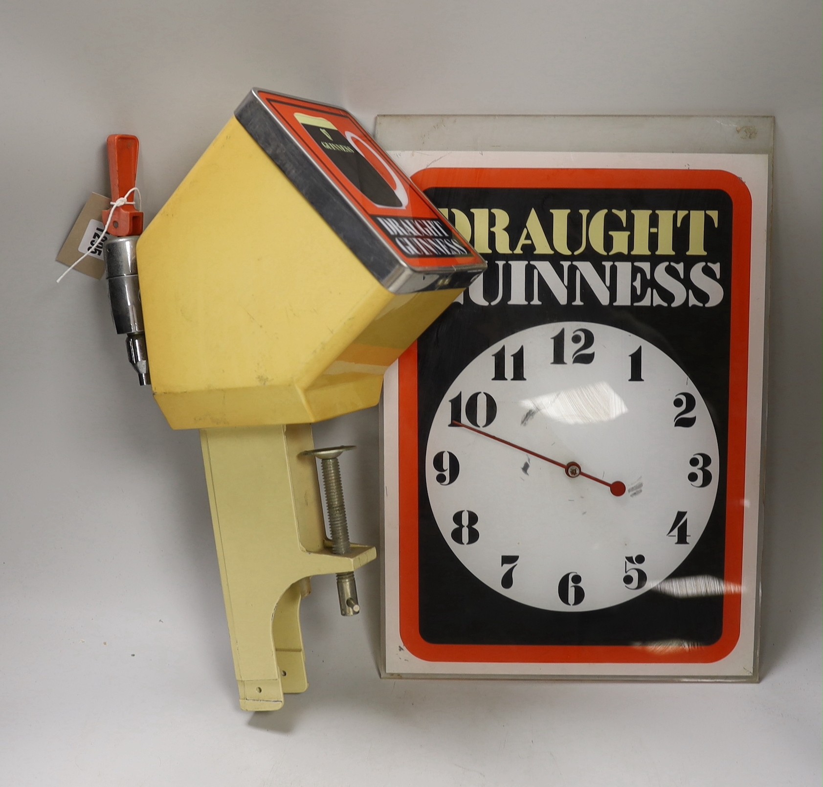 A rare Guinness bar dispenser and a Guinness wall clock