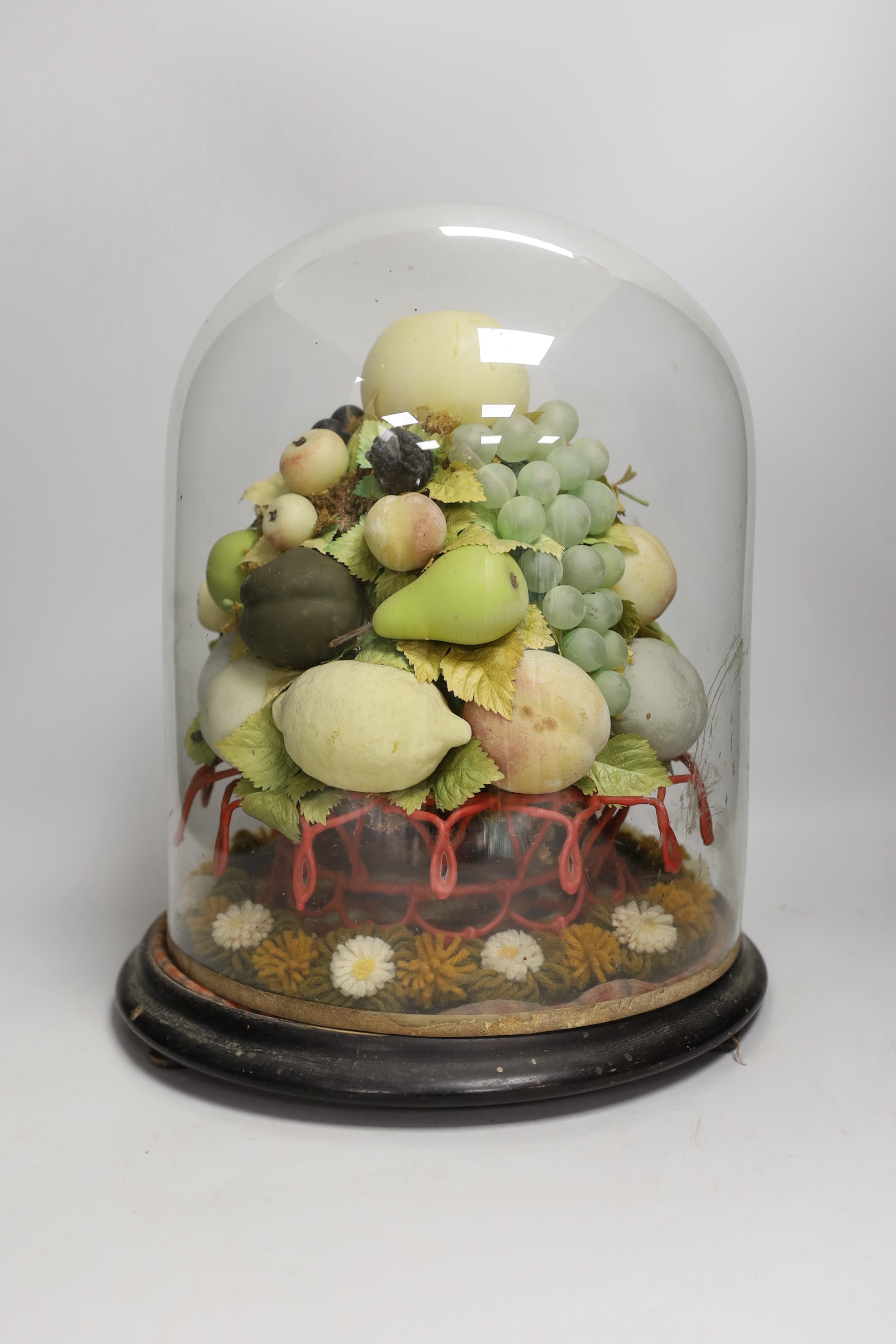 A Victorian wax fruit and woolwork arrangement under a glass dome, 36cm tall