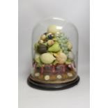 A Victorian wax fruit and woolwork arrangement under a glass dome, 36cm tall