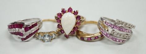 Five assorted modern 9ct gold and gem set dress rings, including ruby and diamond chip, gross weight