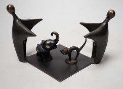 An abstract bronze group, 19cm wide, together with two other figures