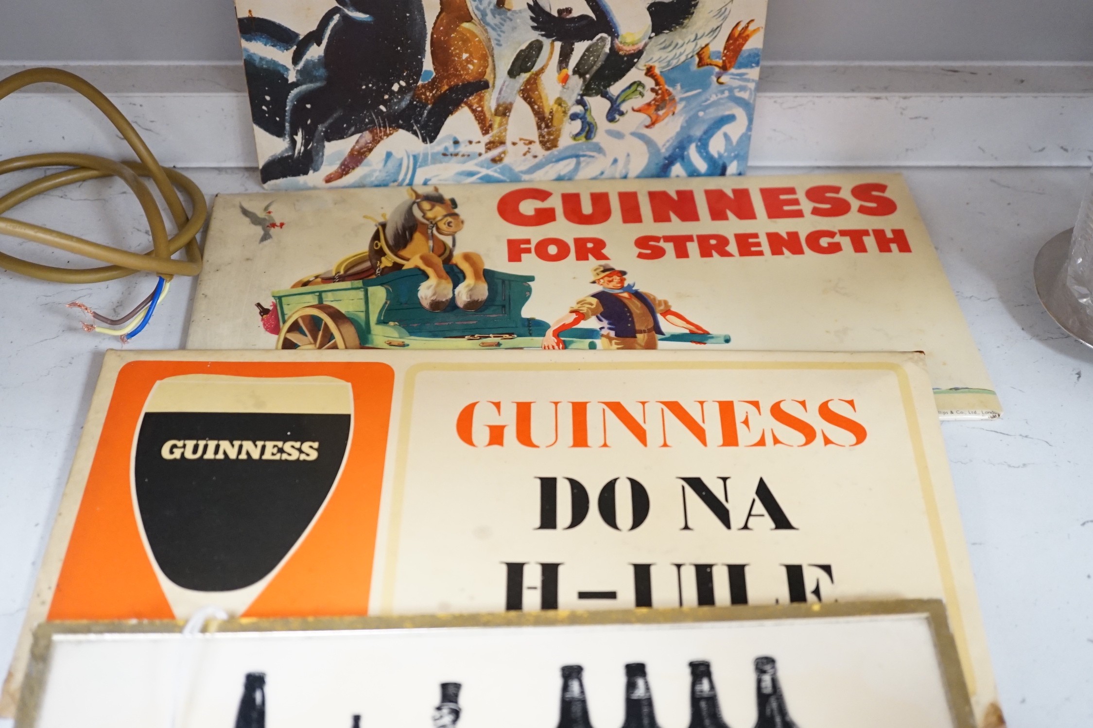Five Guinness advertising signs, mirror, trays and a book - St. James’s Gate Brewery History and - Image 4 of 5