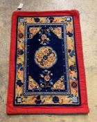 A Tibetan blue ground rug, 95cm x 68cm