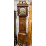 A late 18th century country oak and mahogany crossbanded longcase clock, the 11in. square brass dial