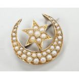 An Edwardian yellow metal and seed pearl set crescent moon and star brooch, 22mm, gross weight 4