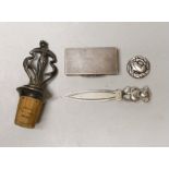 An Art Nouveau metal mounted cork stopper, a Georg Jensen sterling brooch, no. 191, an engine turned