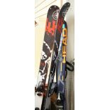 A pair of K2 skis, a pair of Head intelligence skis and a pair of Lexi ski poles