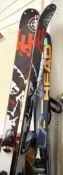 A pair of K2 skis, a pair of Head intelligence skis and a pair of Lexi ski poles