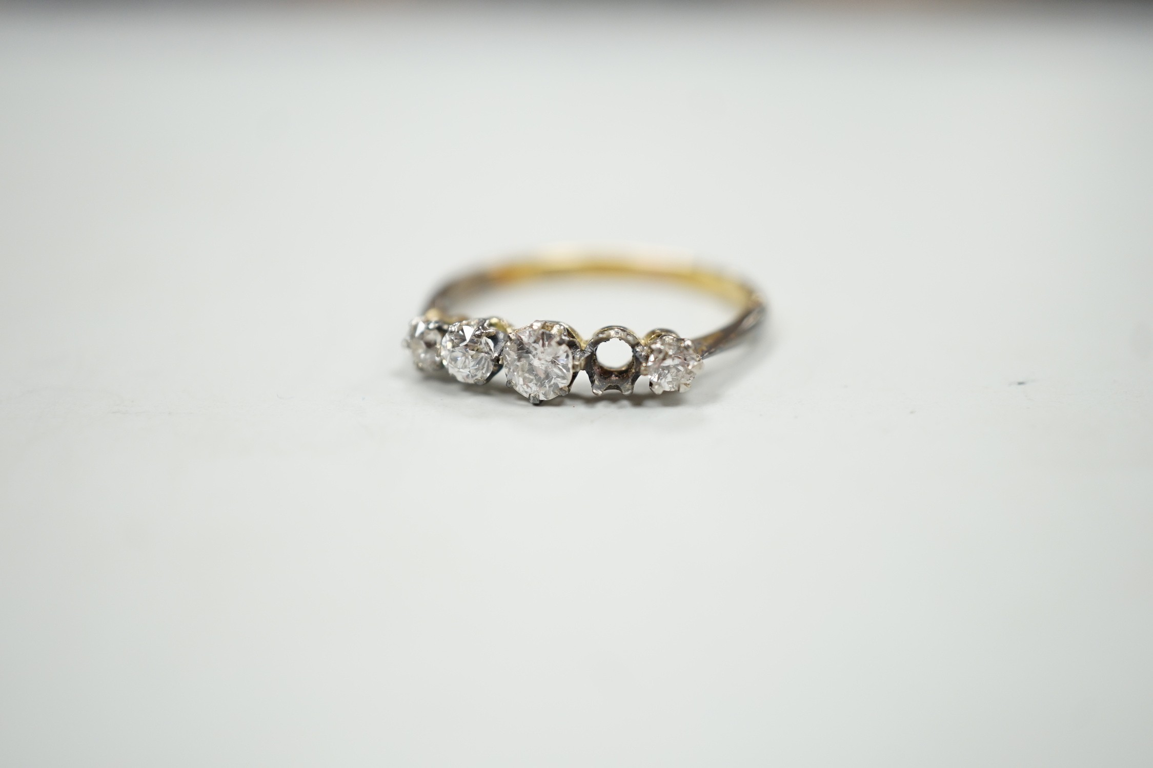 An 18ct and graduated five stone diamond set half hoop ring, size P, gross weight 1.9 grams, one - Image 2 of 4