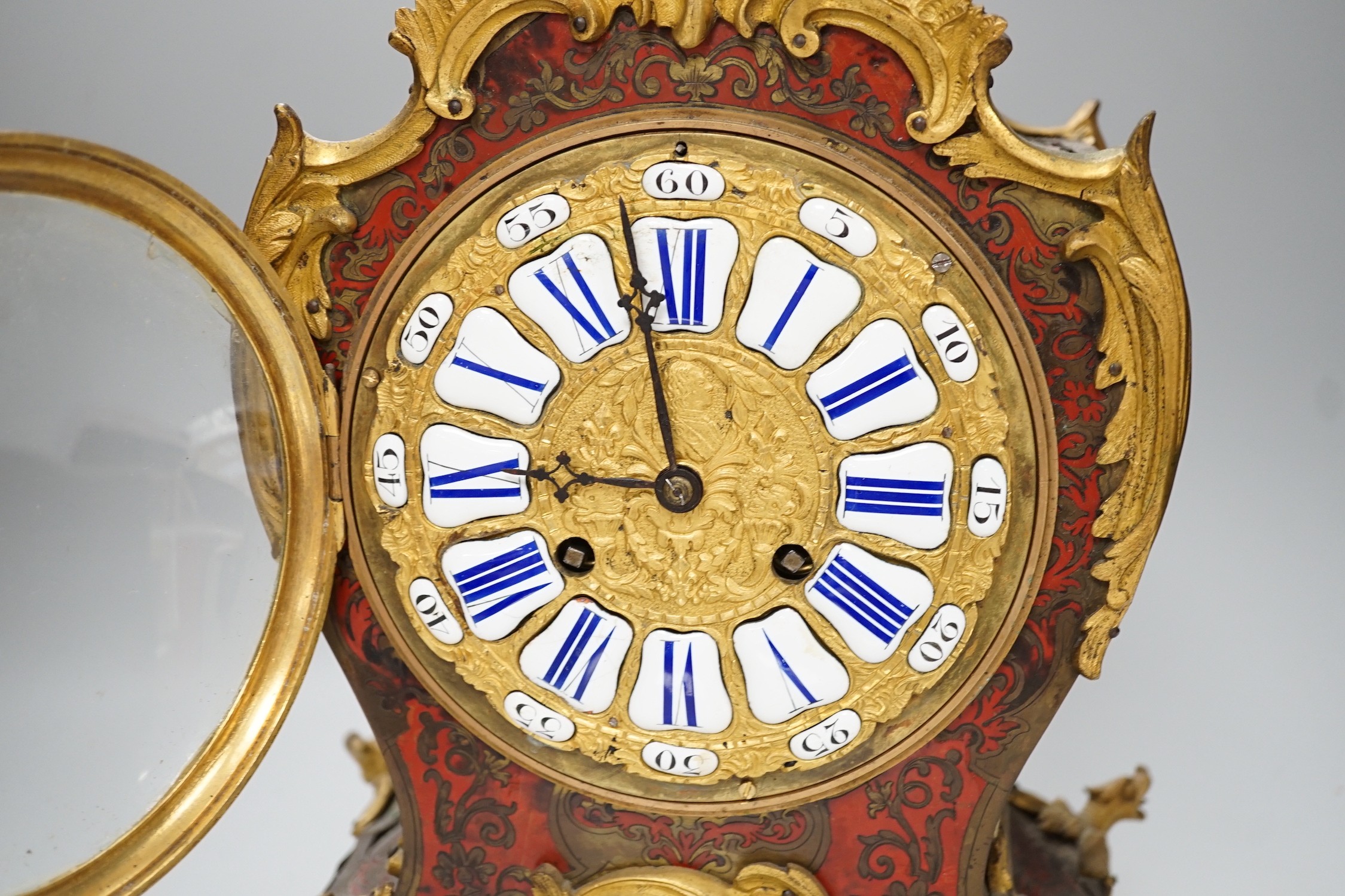 A French scarlet Boulle work and ormolu mounted mantel clock with enamel dial, 45cms high - Image 2 of 6