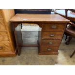 A small 1920's oak four drawer kneehole desk, length 81cm, depth 45cm, height 69cm