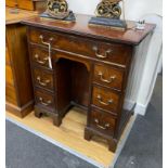 A George III style mahogany kneehole desk, width 73cm, depth 50cm, height 77cm