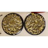A pair of Chinese carved and gilded wood birds and flowers roundels, 33.5cm