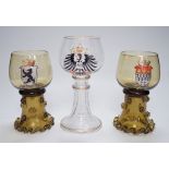 A set of six German enamelled green hock glasses, another larger hock glass and a pair of similar