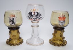A set of six German enamelled green hock glasses, another larger hock glass and a pair of similar