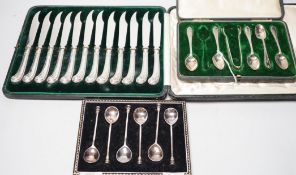 A cased set of twelve silver handled dessert knives, six seal-top teaspoons, five (ex 6) teaspoons