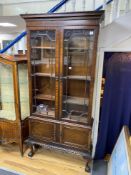 A 1920's Chippendale Revival mahogany bookcase, width 100cm, depth 30cm, height 220cm