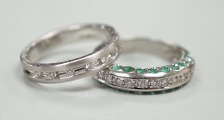 An unusual modern 18ct white gold and thirteen stone diamond chip set half hoop ring, each side of