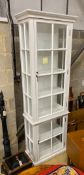 A white painted display cabinet, width 73cm, depth 39cm, height 230cm