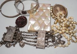 A collection of Victorian and later costume jewellery and a mother of pearl card case.